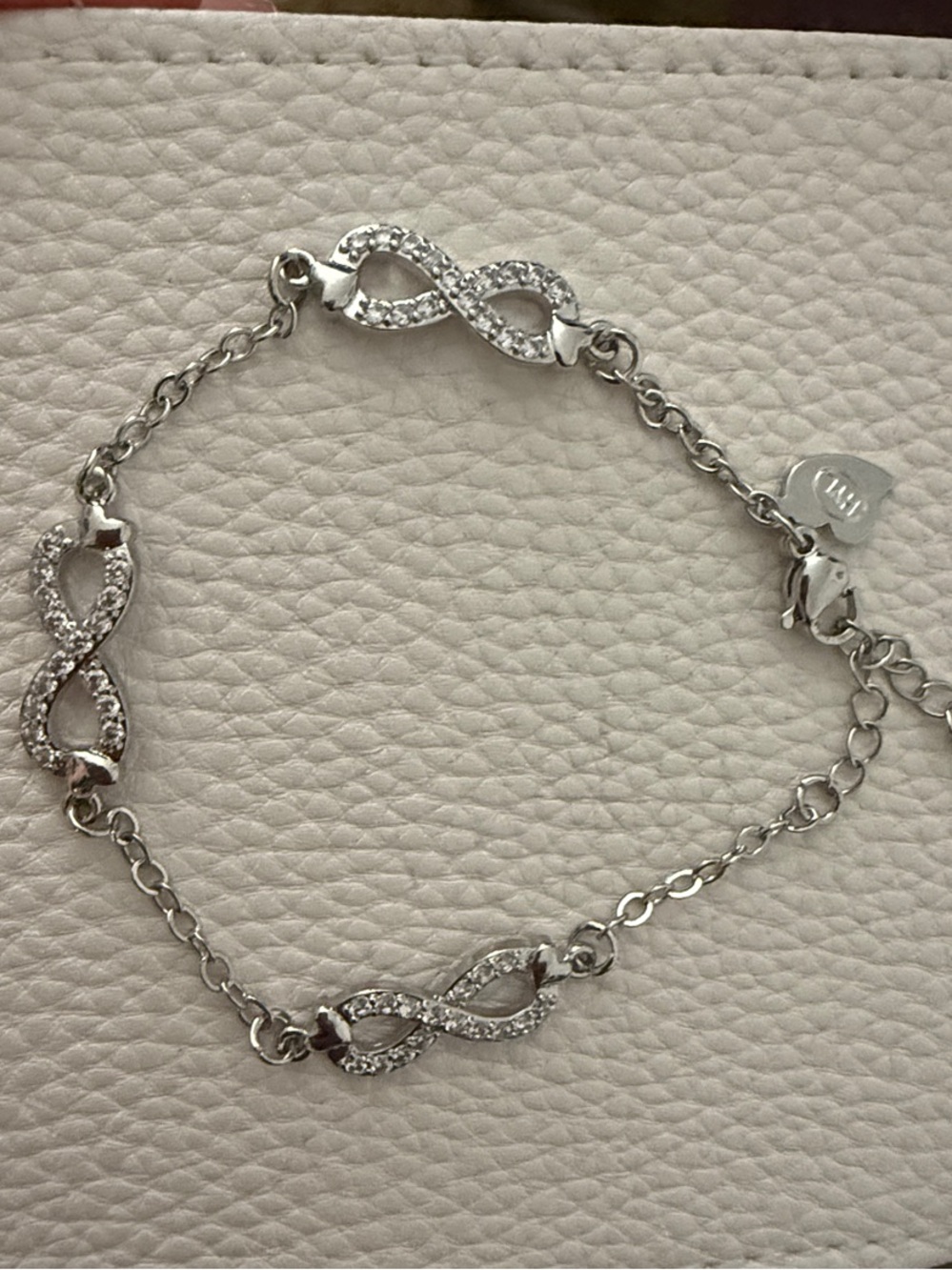 Infinity Link Bracelet with White Crystal Accents - White Gold Plated